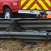 An officer inspects an area near a guardrail on south U.S. 23 north of Six Mile Road in Northfield Township on Monday, March 11, 2013. Melanie Maxwell I AnnArbor.com